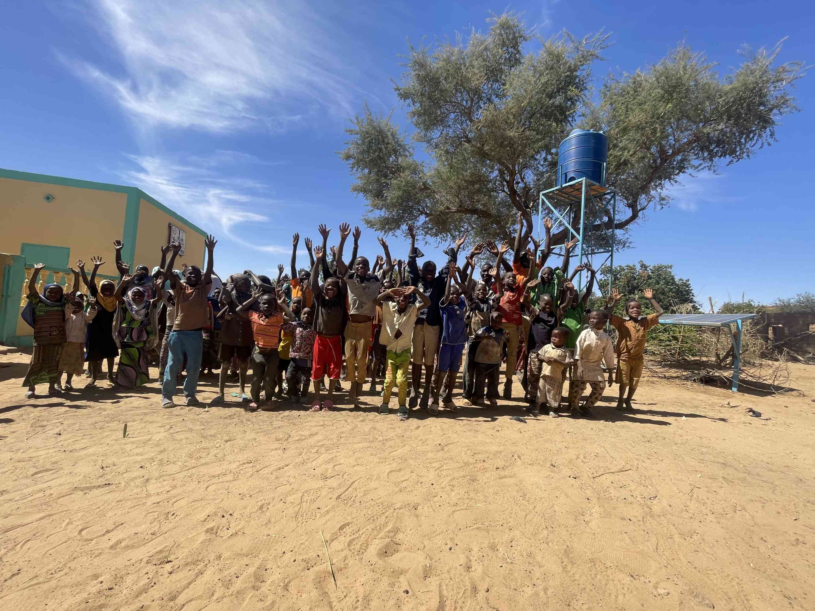 People gathering around a medium community well